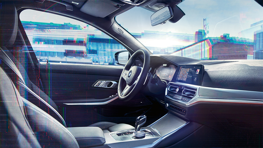 Gros plan de l’habitacle de la BMW Série 3 Berline (G20) avec BMW Live Cockpit Professional.